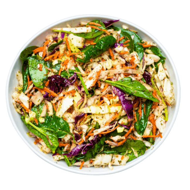 Cabbage Salad with spinach lemon gharlic and mint in a white bowl