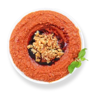 Muhammara dip from Aladdin Mediterranean Cuisine—roasted red pepper & walnut spread drizzled with olive oil.